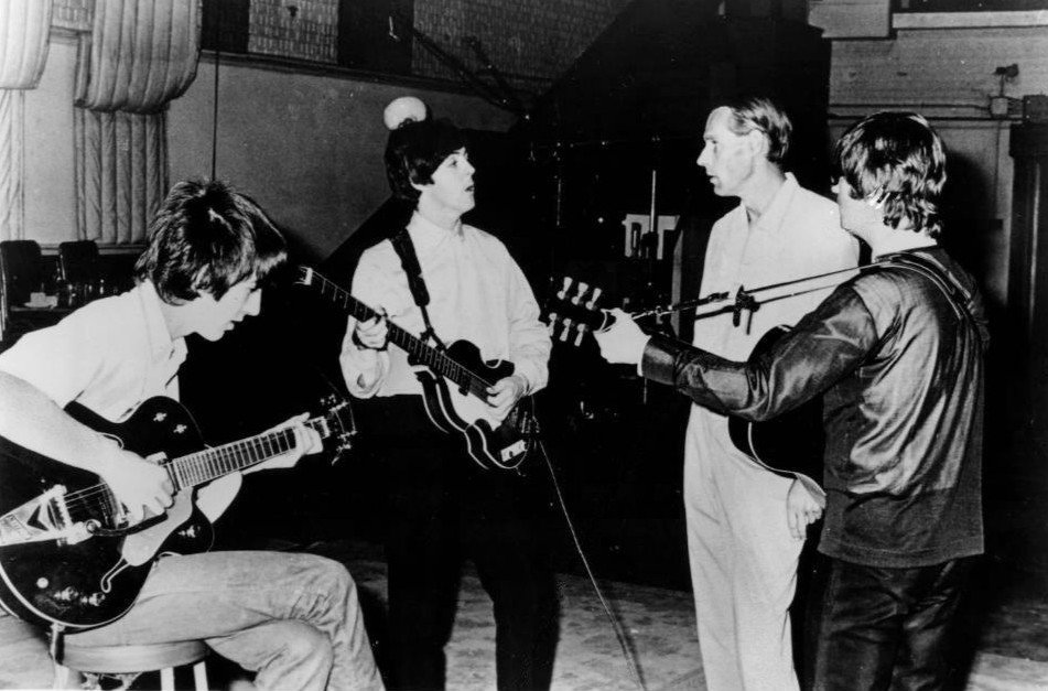 George Martin and the Beatles at Abbey Road Studios in 1966